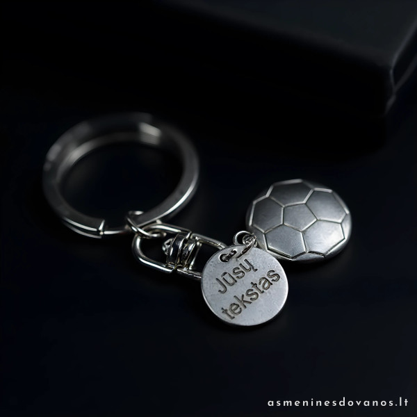 Pakabukas futbolo kamuolys, su graviruotu tekstu. Metalinis.