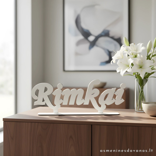 Lazeriu pjautas žodis, suklijuotas, gali būti pavardė, vardas ar vieta